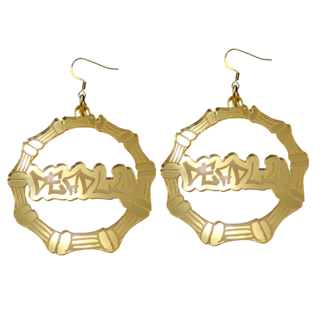 An image of Haus of Dizzy's large gold mirror bamboo hoops with 'Deadly' text in graffitti font, with hook tops.