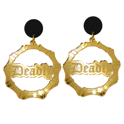 An image of Haus of Dizzy's large gold mirror bamboo hoops with 'Deadly' text in old english font, with matte black circle tops.