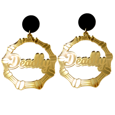 An image of Haus of Dizzy's large gold mirror bamboo hoops with 'Deadly' text in ollie cursive font, with matte black circle tops.