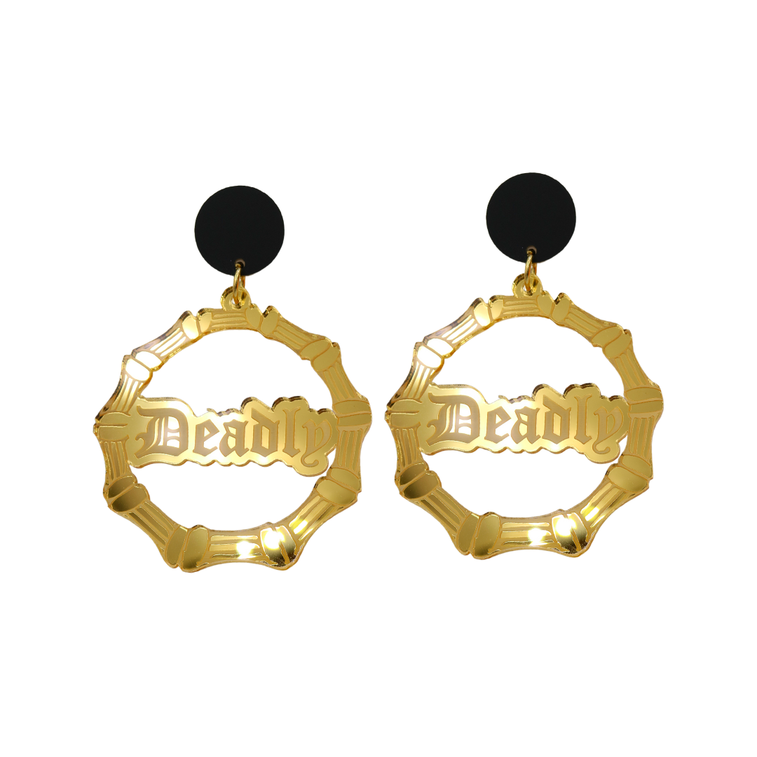 An image of Haus of Dizzy's small gold mirror bamboo hoops with 'Deadly' text in old english font, with matte black circle tops.