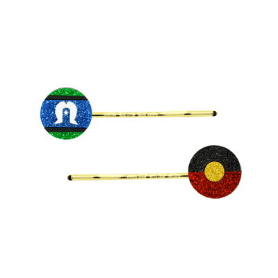 An Image of Haus of Dizzy's Circle Shaped Glitter Aboriginal and Torres Strait Islander Flag Hair Pins. Flags are on Gold Pins