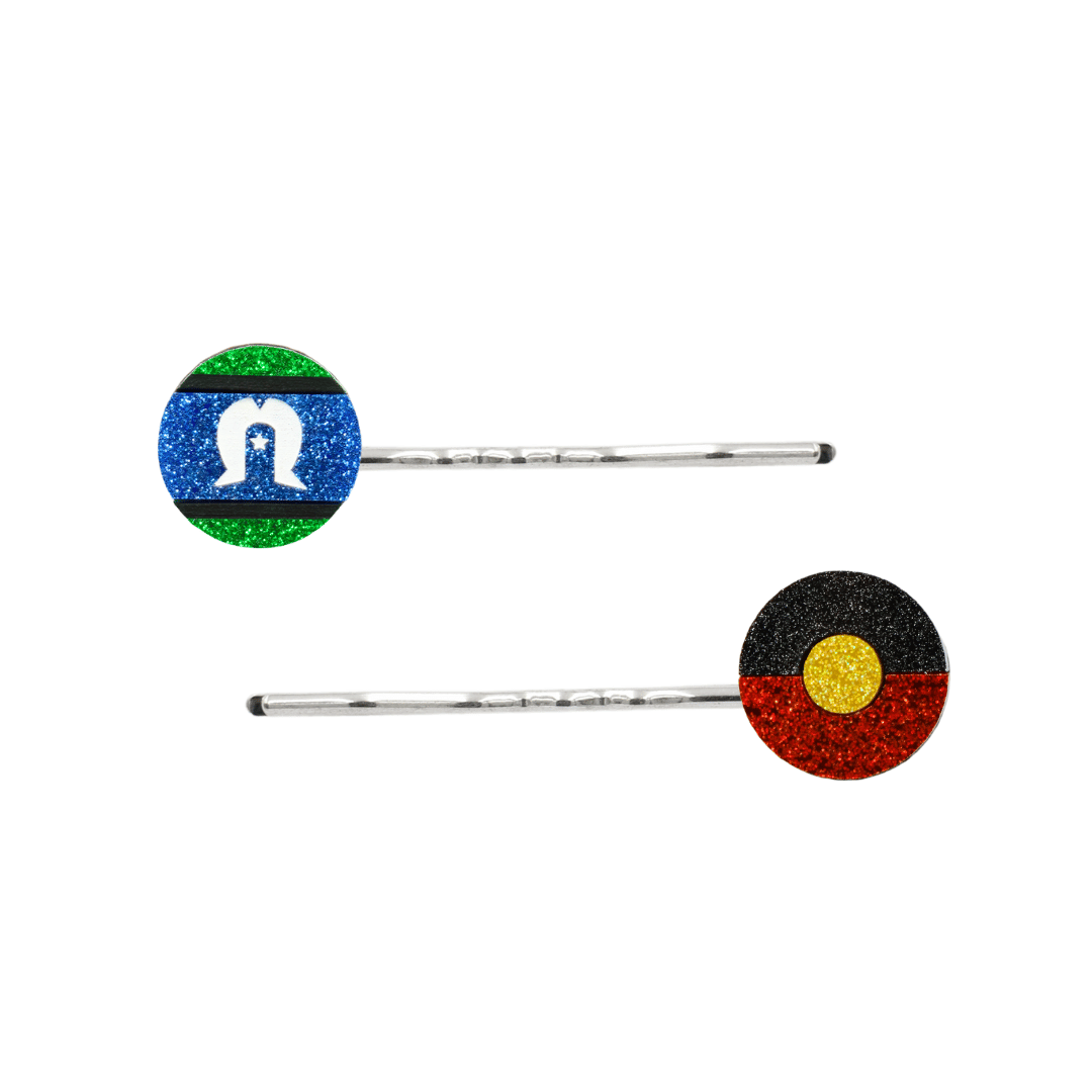 An Image of Haus of Dizzy's Circle Shaped Glitter Aboriginal and Torres Strait Islander Flag Hair Pins. Flags are on Silver Pins