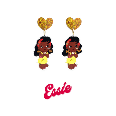 An image of Haus of Dizzy's Dizzy Chicks acrylic dangle earrings, with a doll with medium length Dark Brown Wavy hair in a Yellow Dress and bamboo queen earrings on a gold crinkle glitter heart top. Red Colour "Essie" Cursive Text is at the bottom of the image.