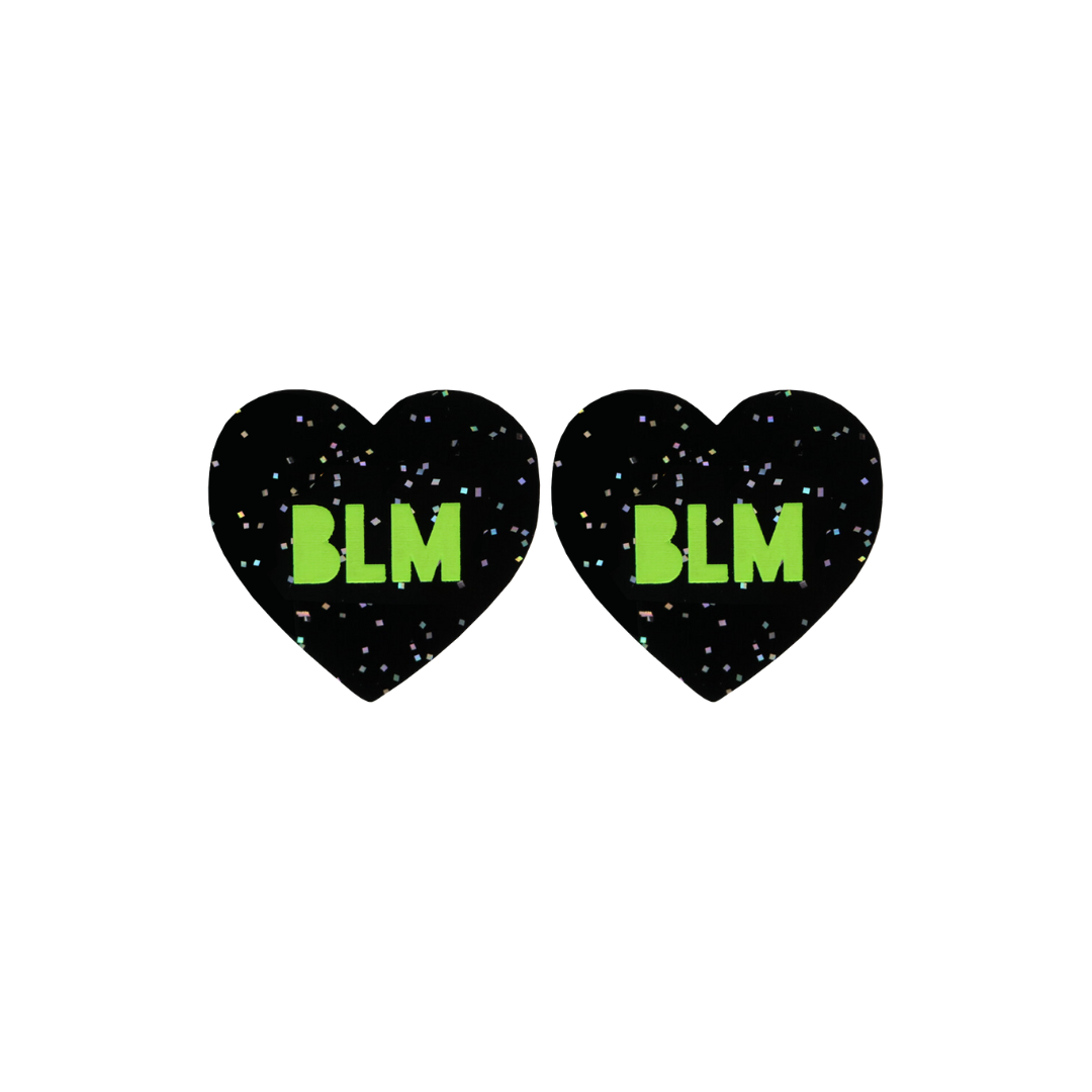 An image of Haus of Dizzy's Small ‘BLM’ heart shaped dangle earrings, with Apple Green “BLM” text on a Black Glitter acrylic stud heart.