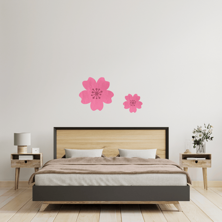 Bedroom with Haus of Dizzy's mirror cherry blossom wall art on a light gray wall.