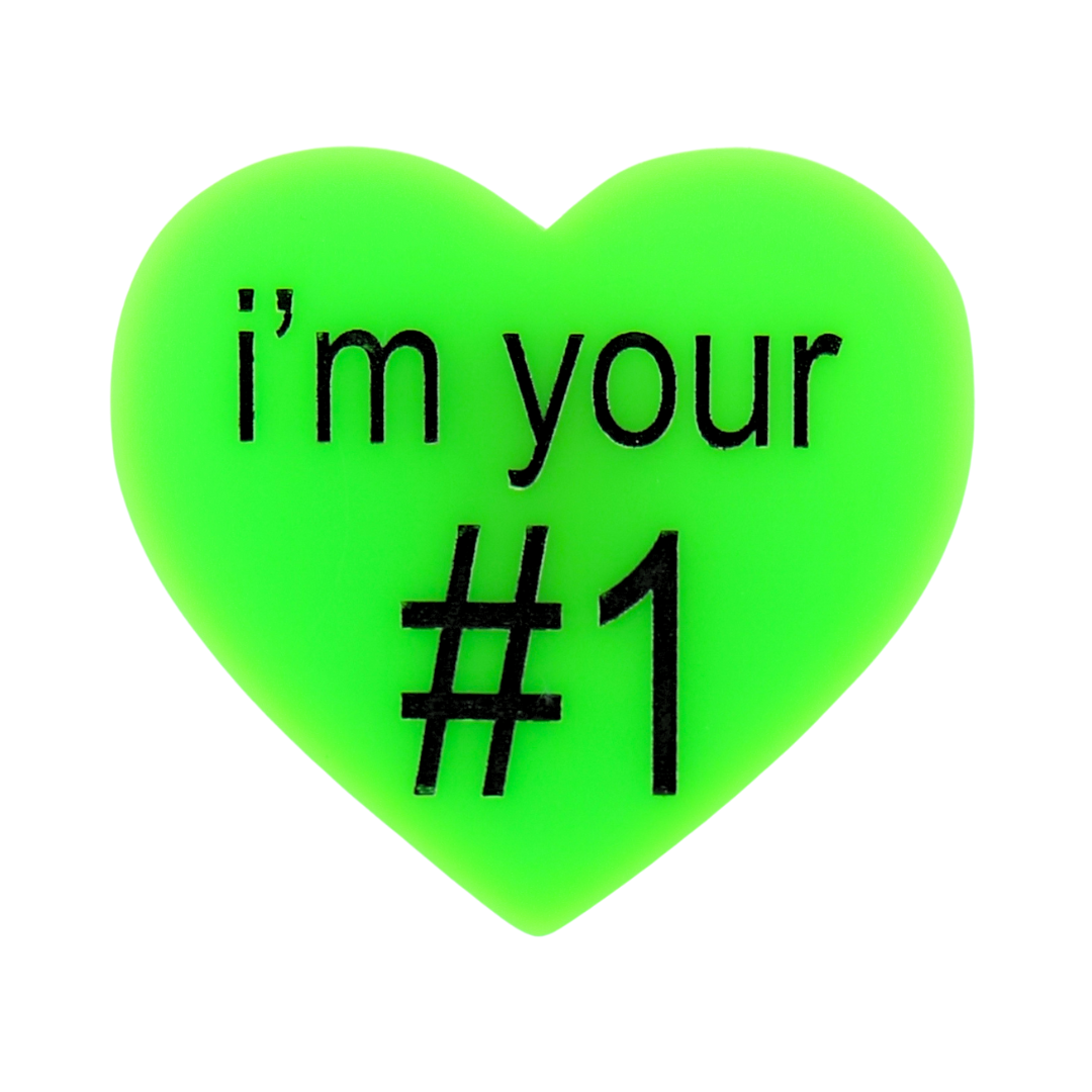 An image of Haus of Dizzy's large I’m your number one heart shaped pin, with i’m your #1 black text on neon green acrylic.