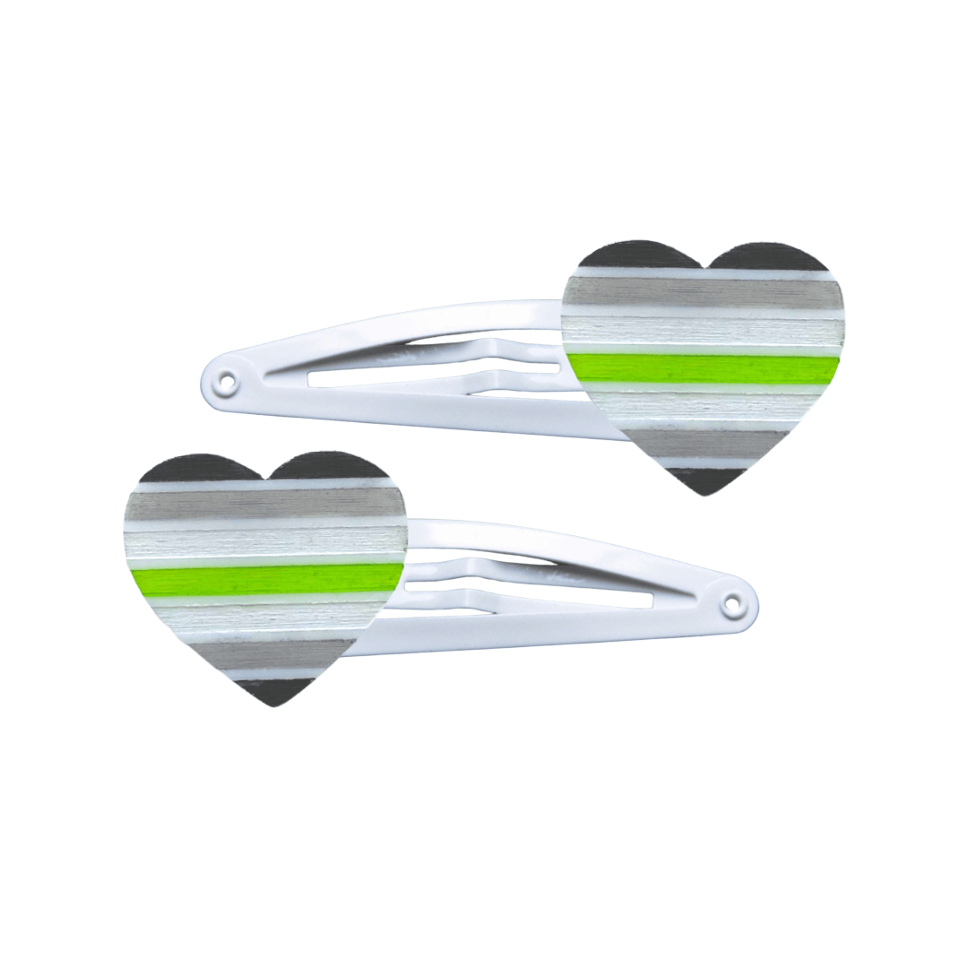 Two heart-shaped agender pride flag hair clips on a white background