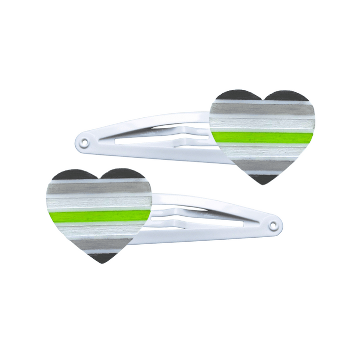 Two heart-shaped agender pride flag hair clips on a white background