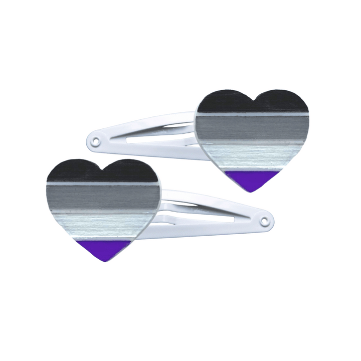 Two heart-shaped asexual pride flag hair clips on a white background