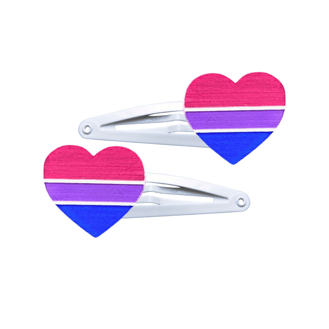 Two heart-shaped bisexual pride flag hair clips on a white background