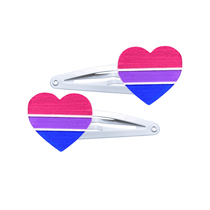 Two heart-shaped bisexual pride flag hair clips on a white background
