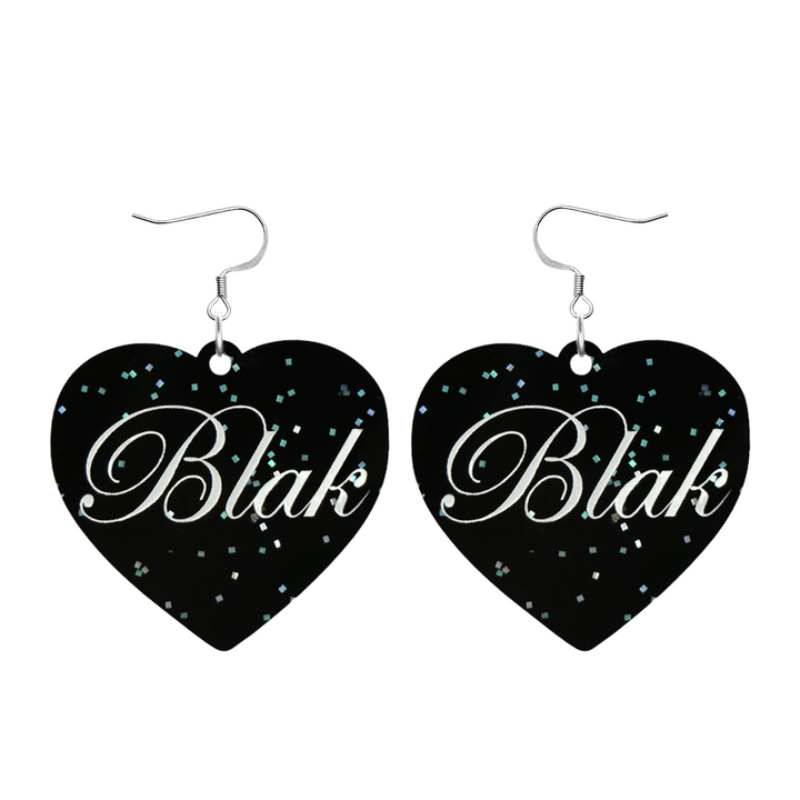 Black glitter Heart-shaped earrings with white 'Blak' text and silver hooks (no heart tops) on a white background