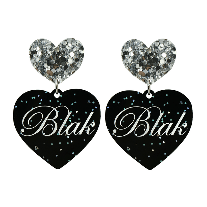 Black glitter heart-shaped earrings with silver glittery heart tops and 'Blak' written on them in white text