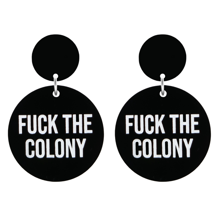 An image of Haus of Dizzy's Fuck the Colony circle-shaped dangle earrings, with Fuck the Colony text on gloss black acrylic and a gloss black circle top.