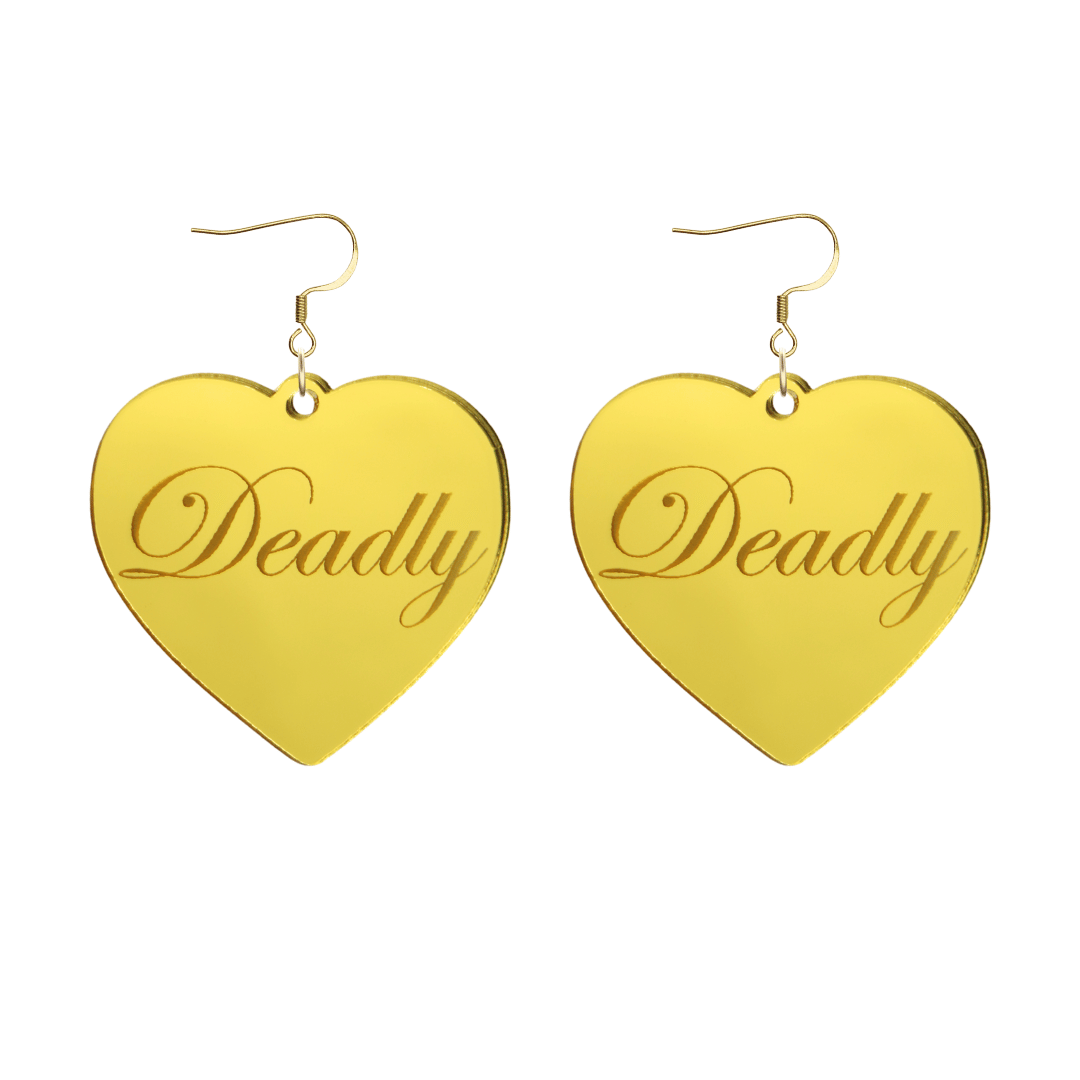 Heart-shaped gold mirror acrylic earrings with 'Deadly' engraving on a white background