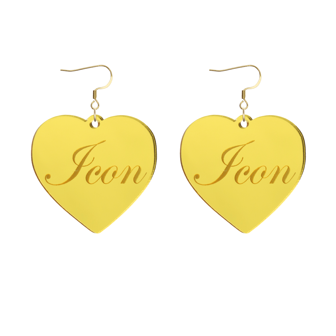 Heart-shaped gold mirror acrylic earrings with cursive script 'Icon' engraving on a white background