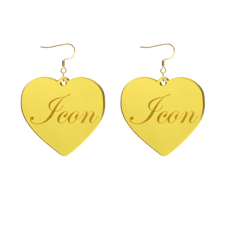Heart-shaped gold mirror acrylic earrings with cursive script 'Icon' engraving on a white background