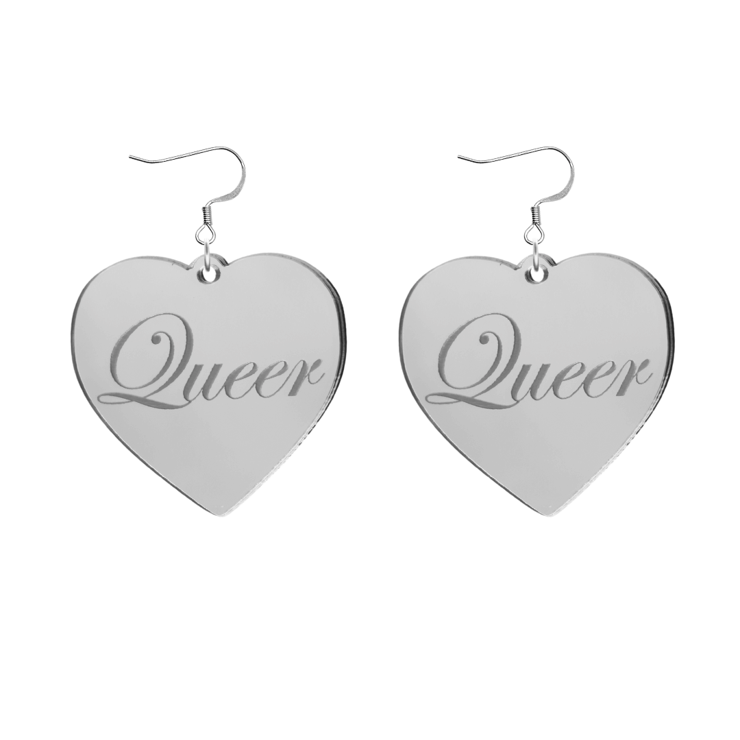 Heart-shaped silver mirror acrylic earrings with 'Queer' engraving on a white background