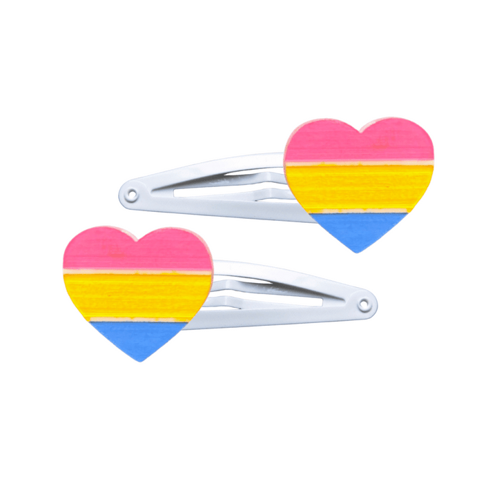 Two heart-shaped pansexual pride flag hair clips on a white background