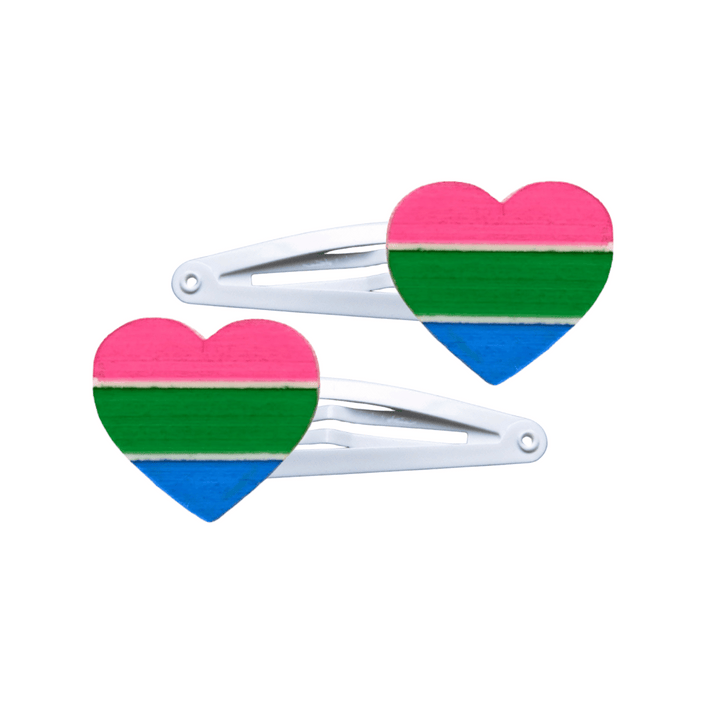 Two heart-shaped polysexual pride flag hair clips on a white background