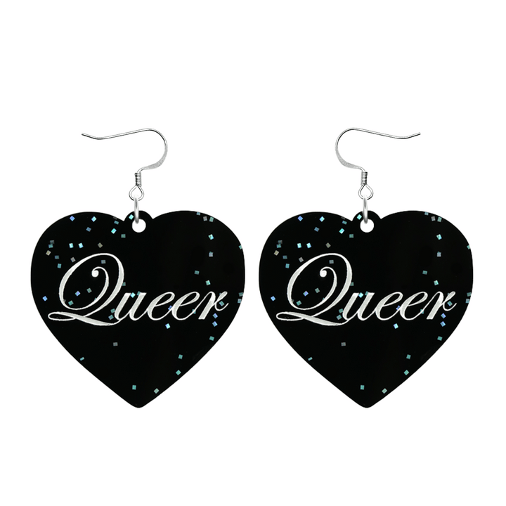 Black glitter Heart-shaped earrings with white text that says 'Queer', and silver hooks (no heart tops) on a white background