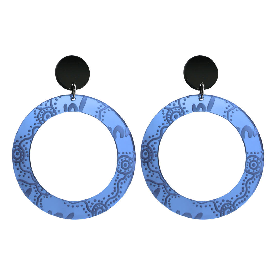 Pair of large, blue mirror, acrylic hoop earrings with Aboriginal artwork pattern with black circular earring top. Earrings are on a white background