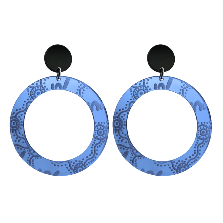 Pair of large, blue mirror, acrylic hoop earrings with Aboriginal artwork pattern with black circular earring top. Earrings are on a white background