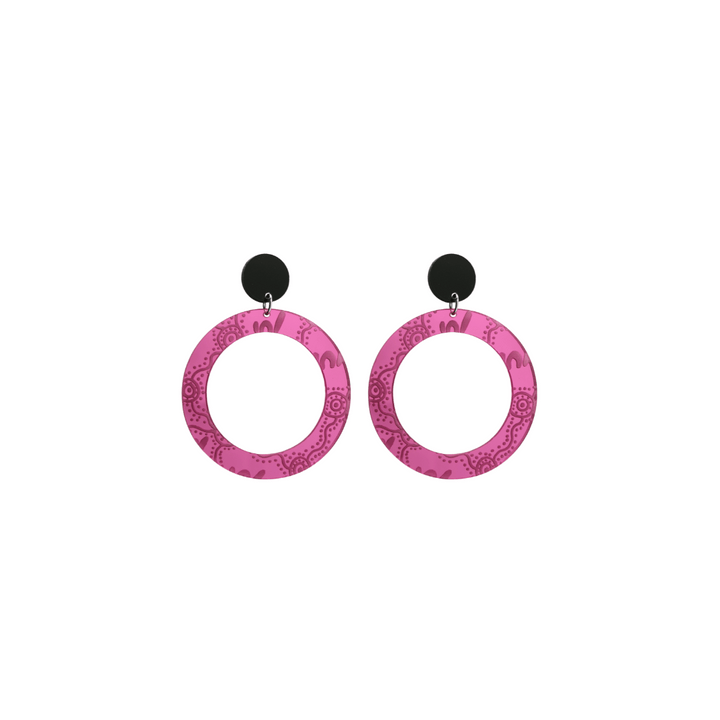 Pair of extra small, pink mirror, acrylic hoop earrings with Aboriginal artwork pattern with black circular earring top. Earrings are on a white background