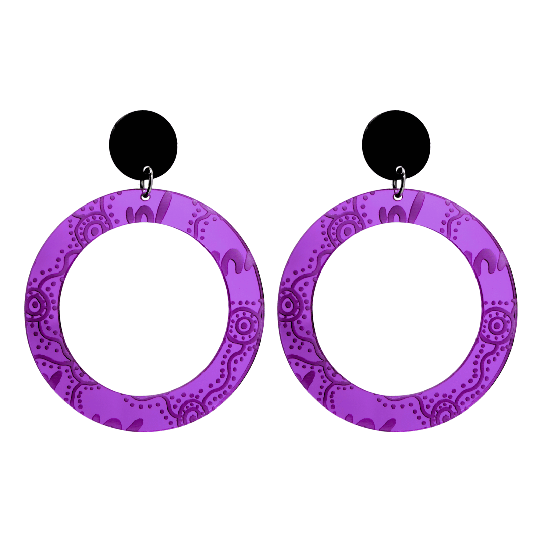 Pair of large, purple mirror, acrylic hoop earrings with Aboriginal artwork pattern with black circular earring top. Earrings are on a white background