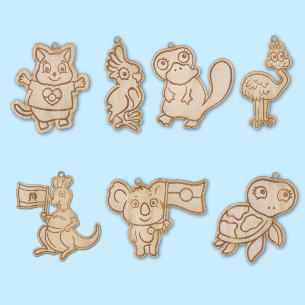 set of 7 wooden haus of ziggy lee haus of dizzy native animal colour in magnets on a light blue background