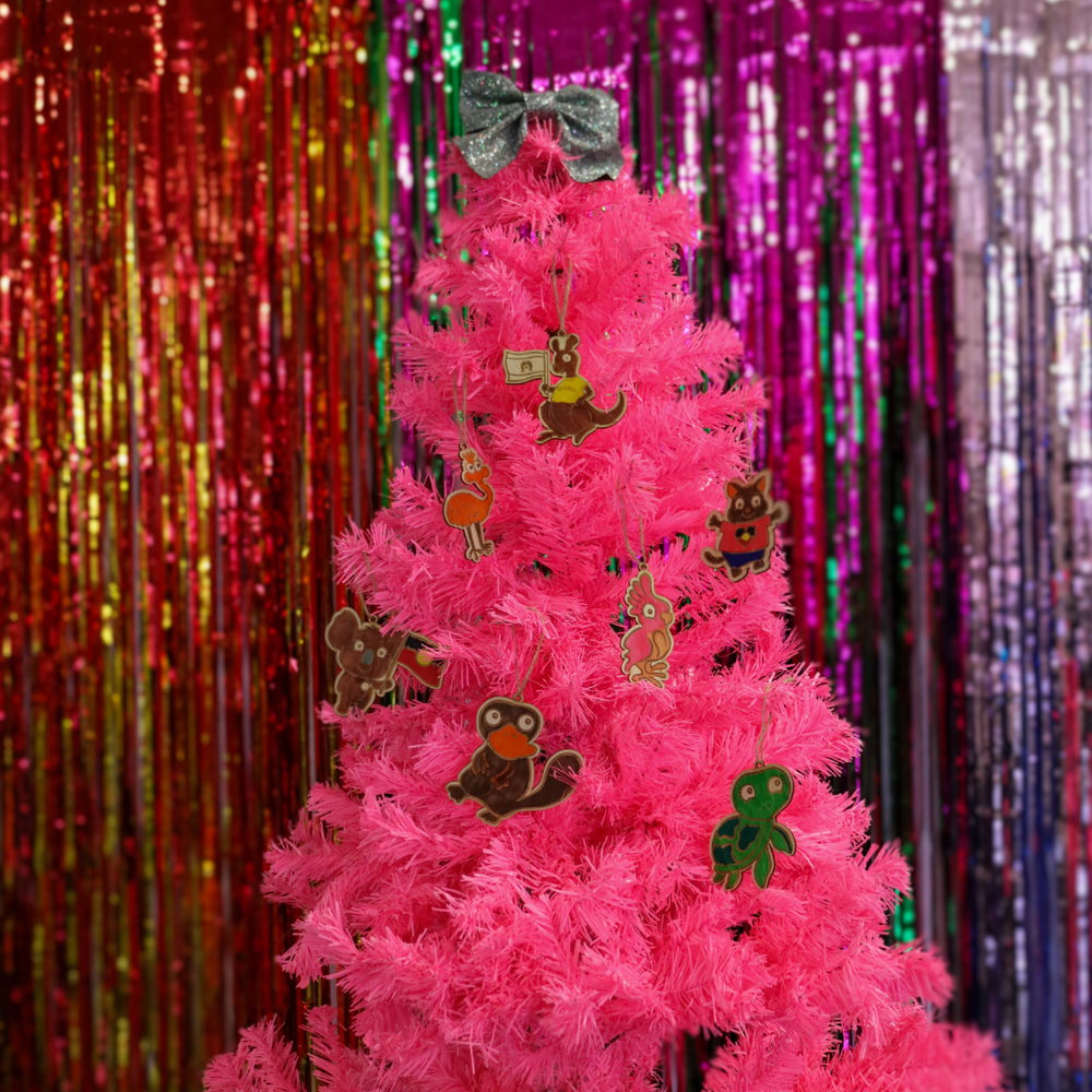 picture of pink christmas tree with haus of ziggy lee ahsu of dizzy native animal wooden colouring-in diy craft kit pieces hanging off branches as christmas decor