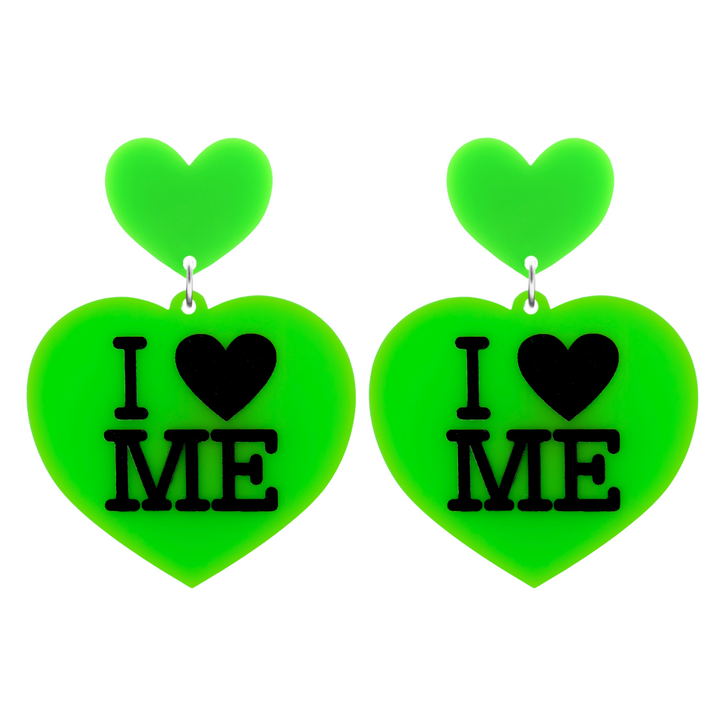 An image of Haus of Dizzy's large I Love Me heart shaped dangle earrings, with I Heart Me text on neon green acrylic and a neon green heart top.