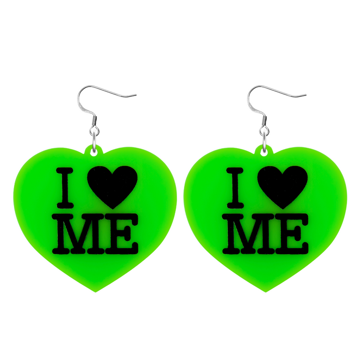 An image of Haus of Dizzy's large I Love Me heart shaped dangle earrings, with I Heart Me text on neon green acrylic and a hook top.