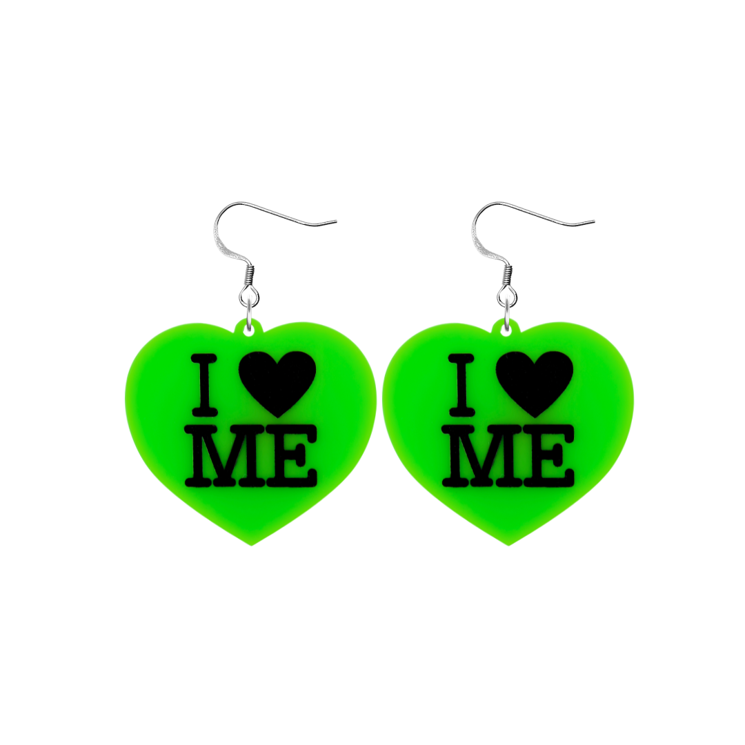 An image of Haus of Dizzy's small I Love Me heart shaped dangle earrings, with I Heart Me text on neon green acrylic and a hook top.