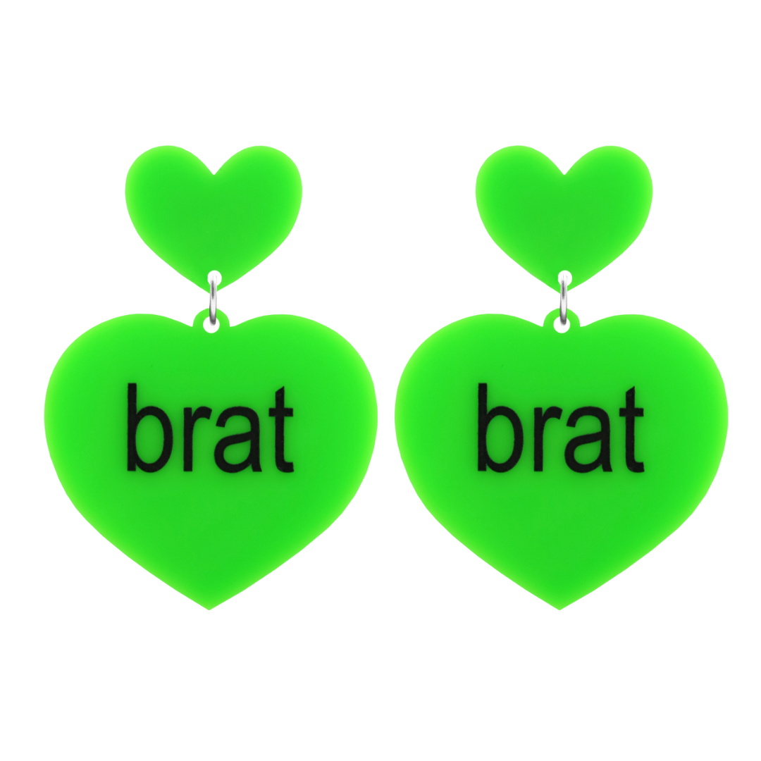 An image of Haus of Dizzy's large brat summer heart shaped dangle earrings, with brat text on neon green acrylic and a neon green heart top.