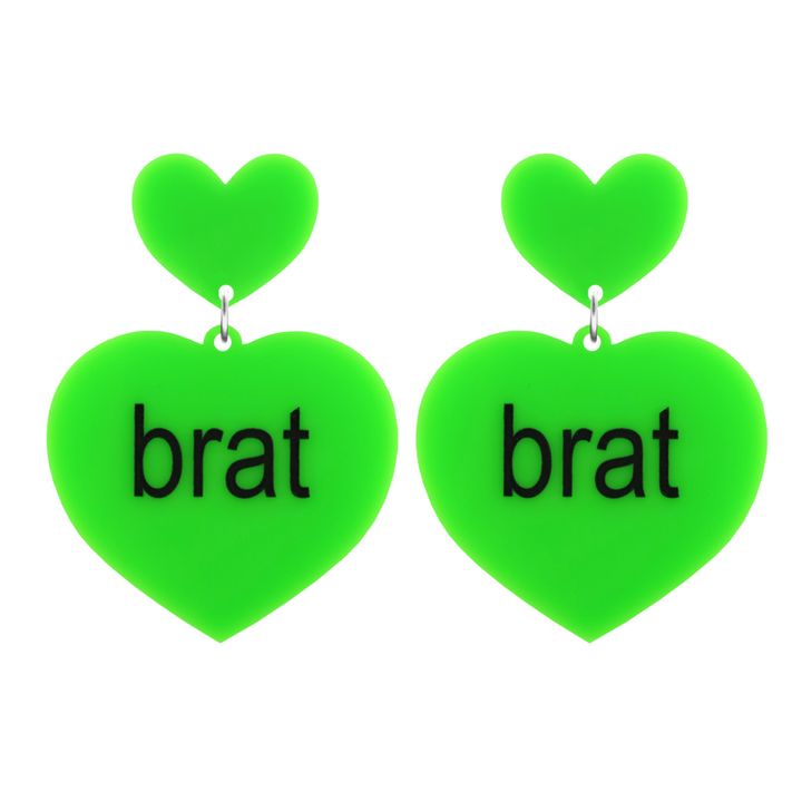 An image of Haus of Dizzy's large brat summer heart shaped dangle earrings, with brat text on neon green acrylic and a neon green heart top.