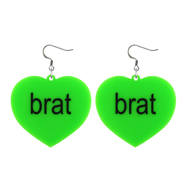 An image of Haus of Dizzy's large brat summer heart shaped dangle earrings, with brat text on neon green acrylic and a hook top.