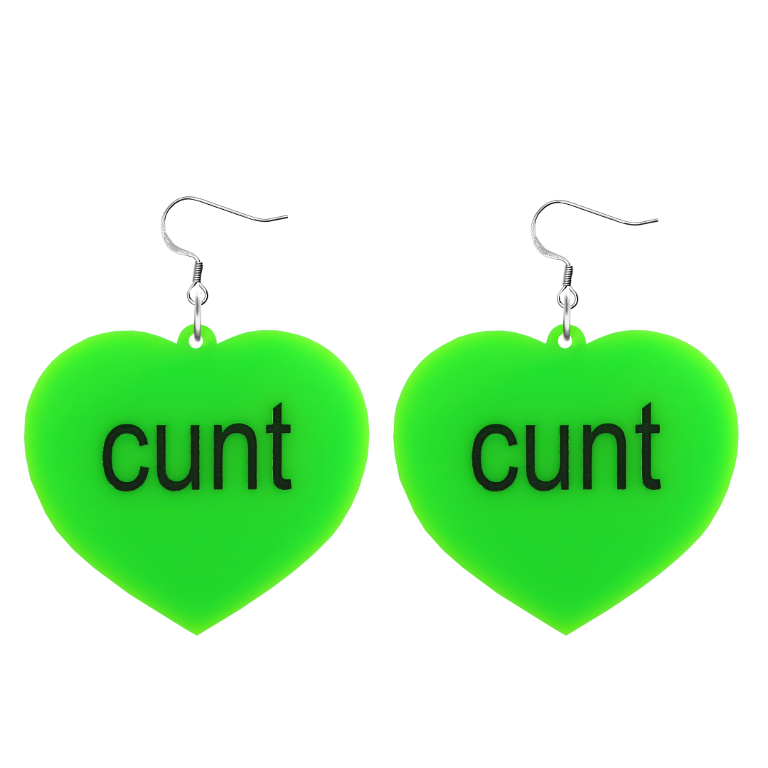 An image of Haus of Dizzy's large brat summer heart shaped dangle earrings, with cunt text on neon green acrylic and a hook top.