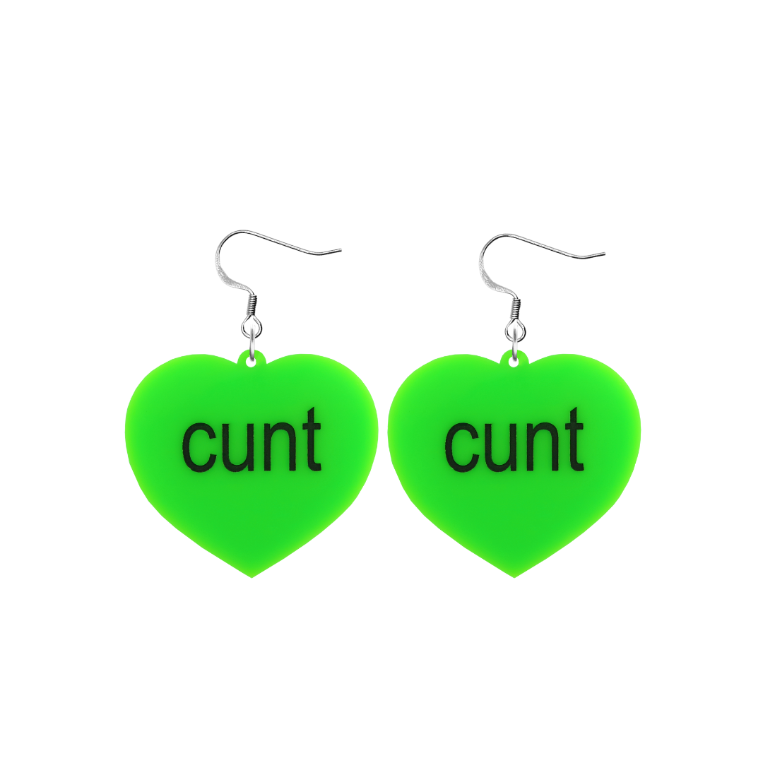 An image of Haus of Dizzy's small brat summer heart shaped dangle earrings, with cunt text on neon green acrylic and a hook top.