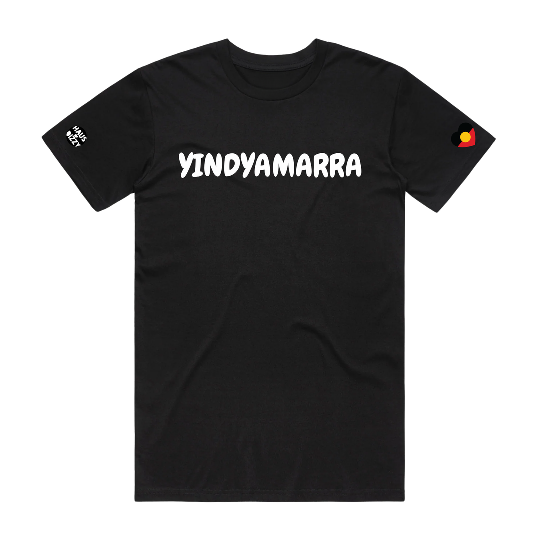 An image of Haus of Dizzy x Haus of Ziggy Lee  Yindyamarra black t-shirt, with white text ‘Yindyamarra’ in the centre and Haus of Dizzy logo on the left sleeve and aboriginal heart flag on the right sleeve. 