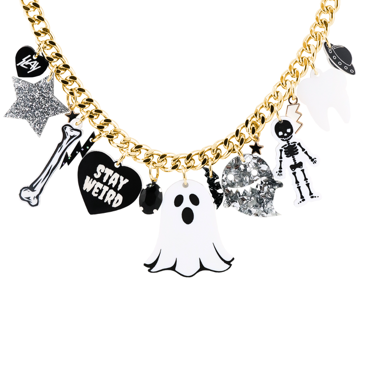 An image of Haus of Dizzy's Ghastly Ghoul Charm Necklace, which features various Halloween-themed acrylic and enamel charms on a gold chain. 
