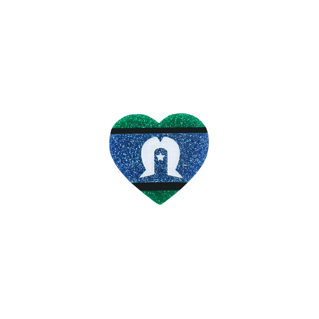 An image of Haus of Dizzy's small, hand-painted Indigenous pride glitter acrylic heart pin with Torres Strait Islander flag.
