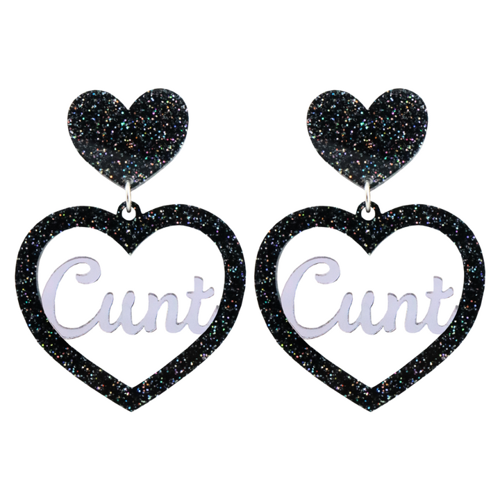 An image of Haus of Dizzy's Large ‘Cunt' heart shaped dangle earrings, with mirror "Cunt" text on a Black Glitter acrylic stud heart.