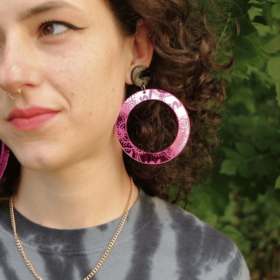 model wearing haus of dizzy mirror wiradjuri yiana hoop earrings in size large pink mirror
