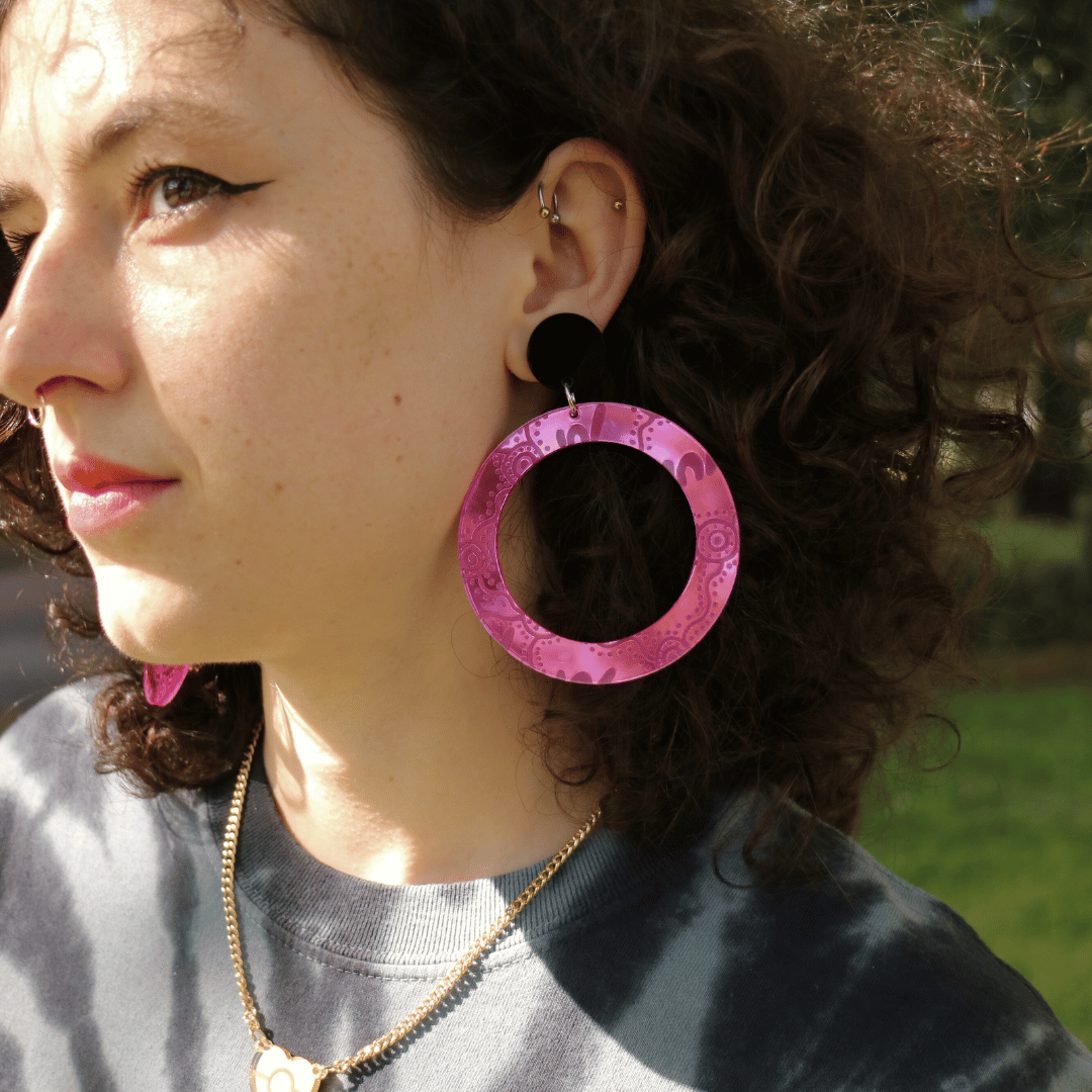 model wearing haus of dizzy mirror wiradjuri yiana hoop earrings in size large pink mirror