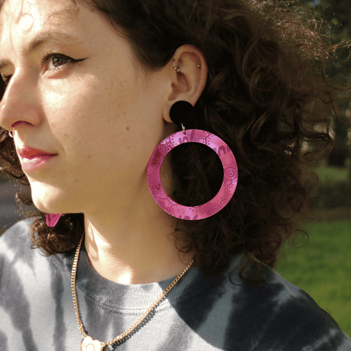 model wearing haus of dizzy mirror wiradjuri yiana hoop earrings in size large pink mirror