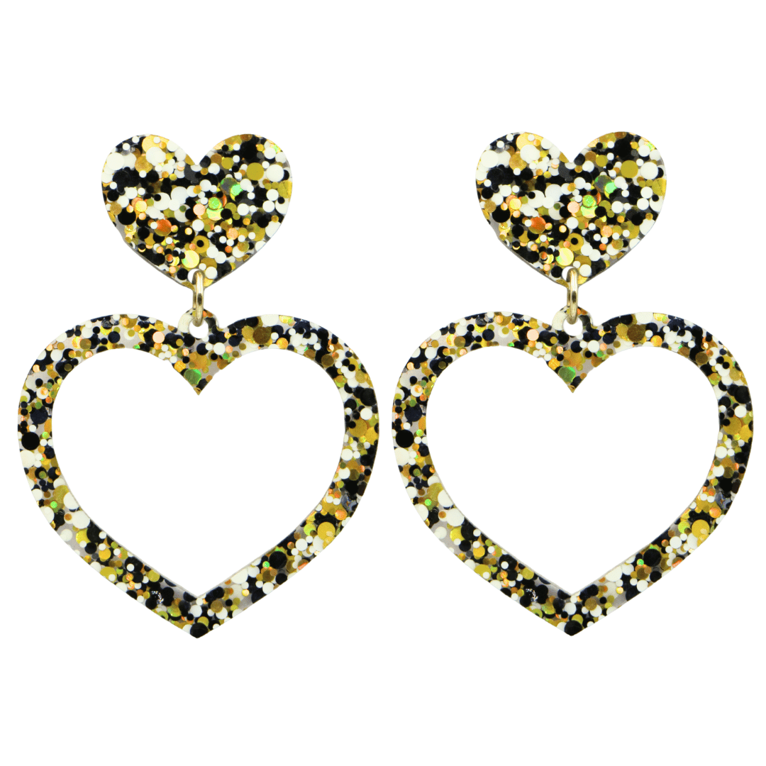 haus of dizzy confetti barbie heart earrings with white black and gold glitter through a clear base size large