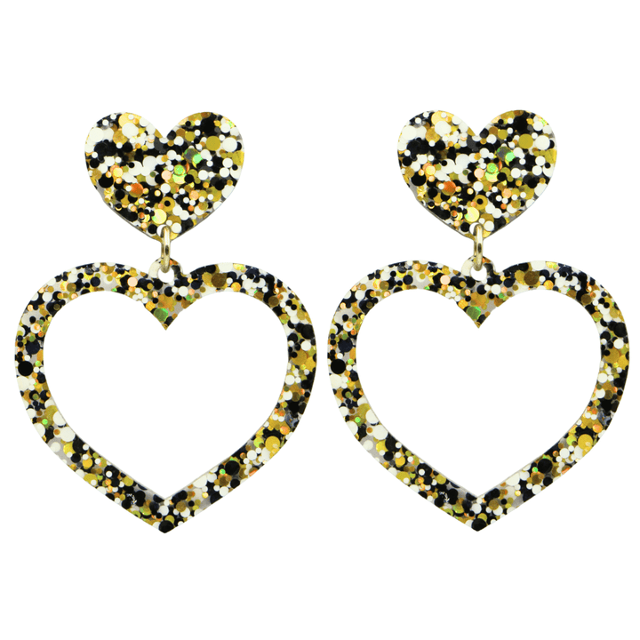 haus of dizzy confetti barbie heart earrings with white black and gold glitter through a clear base size large