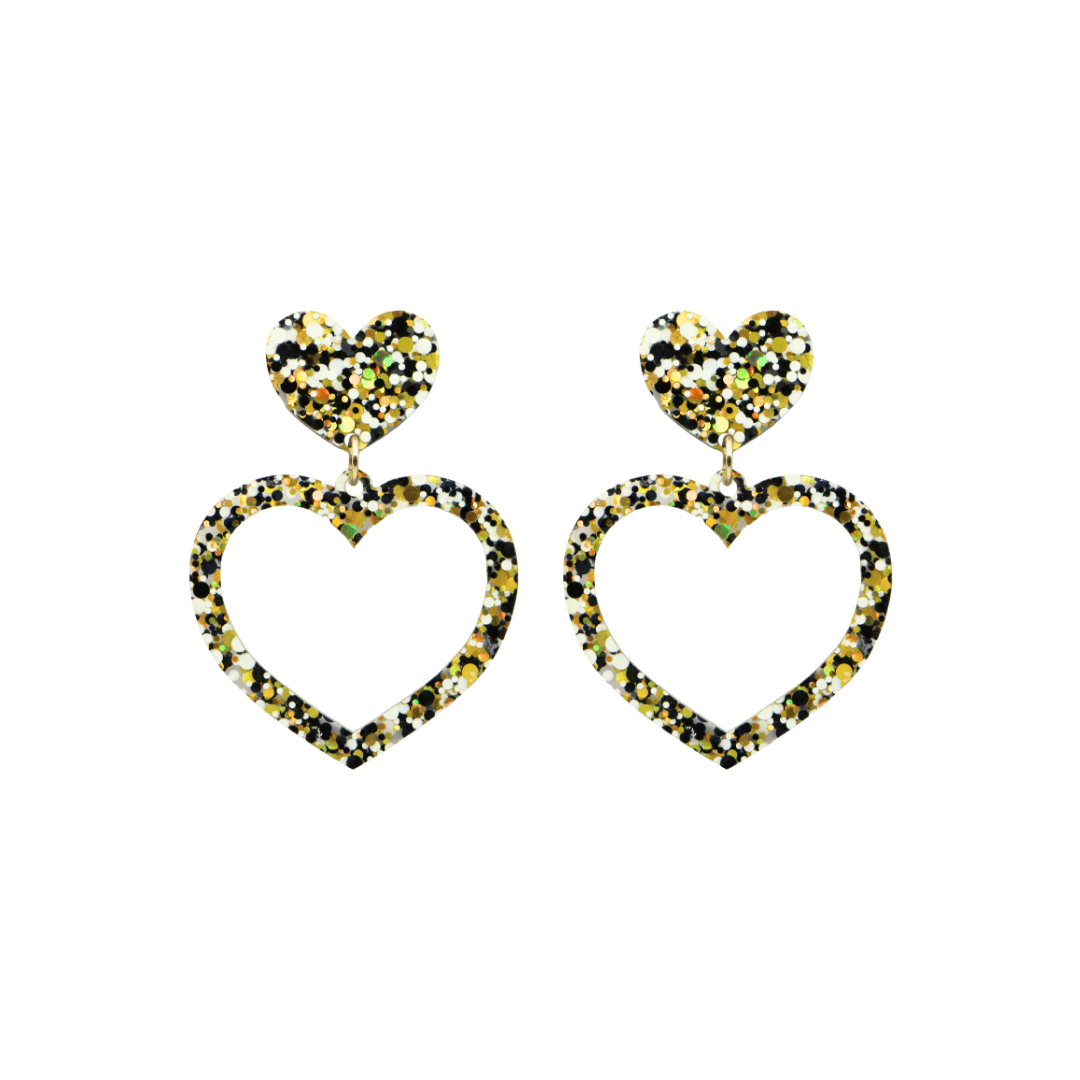 haus of dizzy confetti barbie heart earrings with white black and gold glitter through a clear base size small