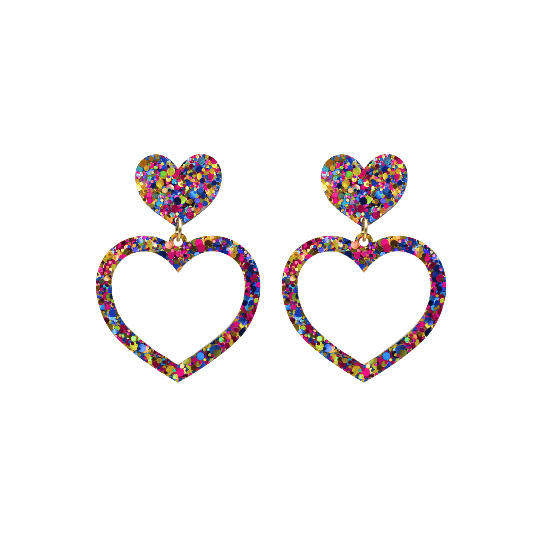 haus of dizzy confetti barbie heart earrings with purple, magenta, and gold glitter through a clear base size small